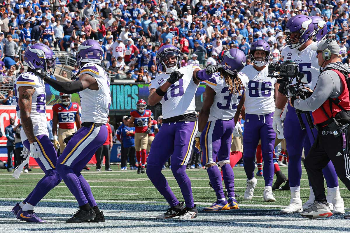 Minnesota Vikings wide receiver Justin Jefferson (18) celebrates his touchdown reception during the first half against the New York Giants at MetLife Stadium. 