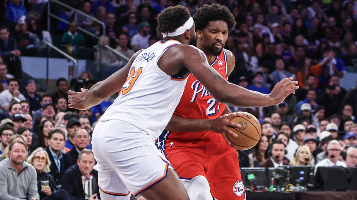 Philadelphia 76ers center Joel Embiid (21) looks to drive past New York Knicks center Mitchell Robinson (23) in the second quarter during game one of the first round for the 2024 NBA playoffs at Madison Square Garden. 