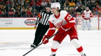 Detroit Red Wings defenseman Moritz Seider (53) skates with the puck against the Pittsburgh Penguins during the second period at PPG Paints Arena.