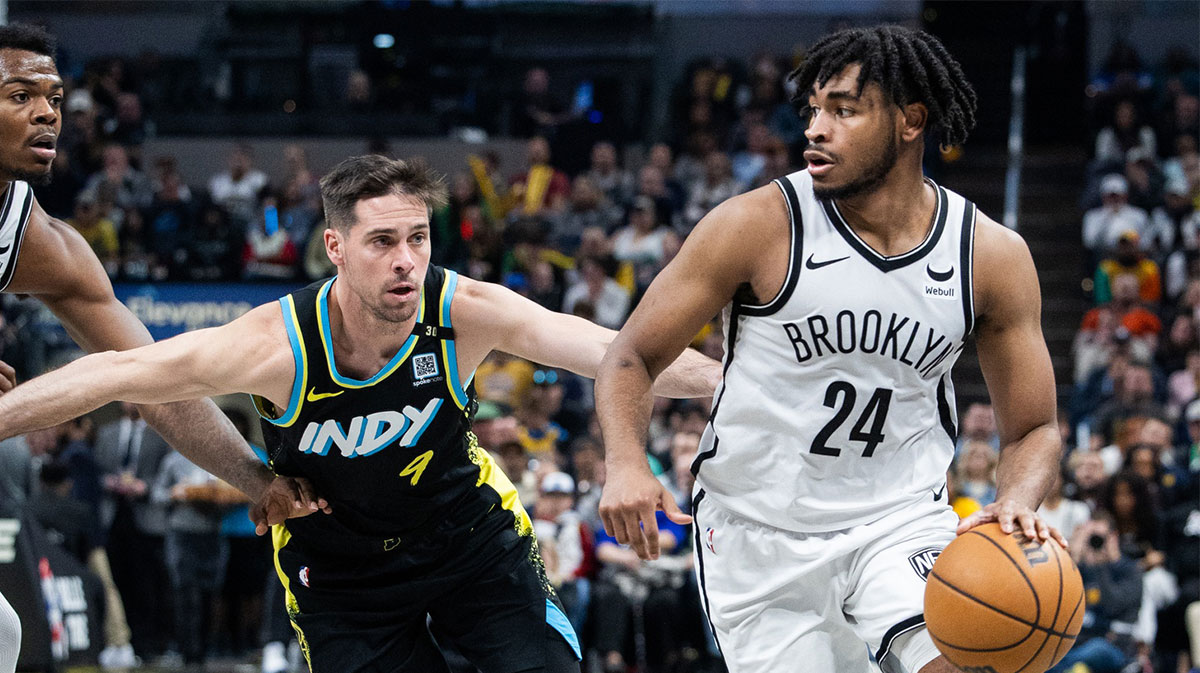 Brooklyn Nets guard Cam Thomas (24) dribbles the ball while Indiana Pacers guard T.J. McConnell (9) defends in the second half at Gainbridge Fieldhouse.