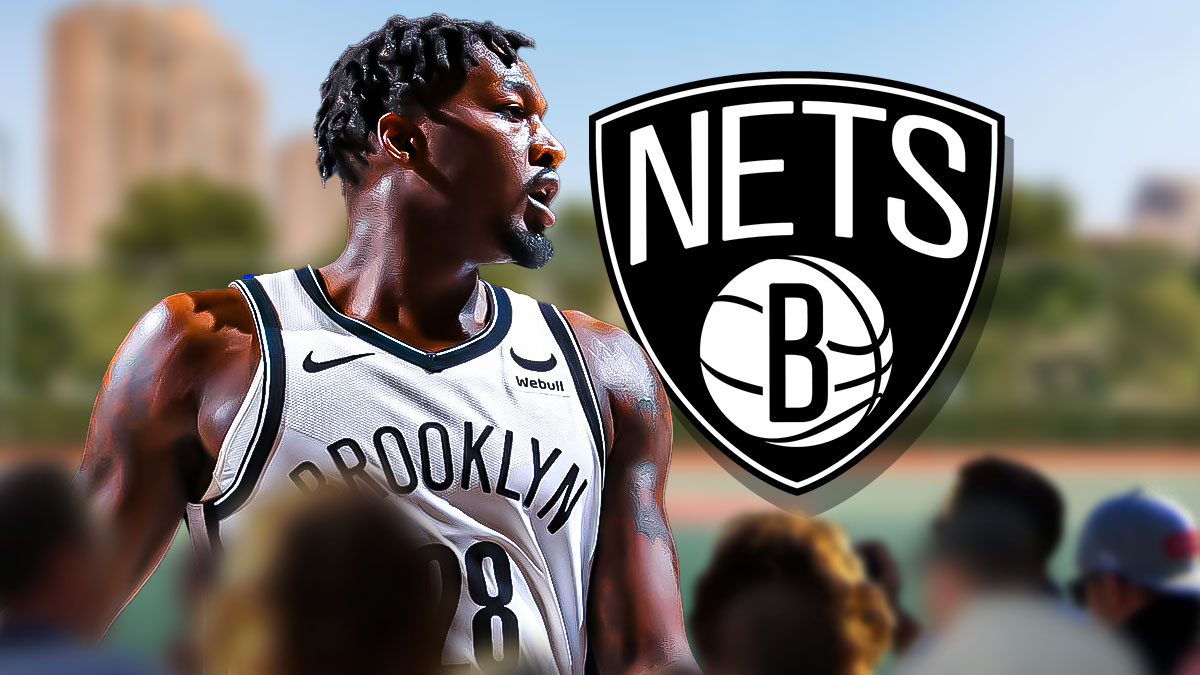 Dorian Finney-Smith beside the Brooklyn Nets logo