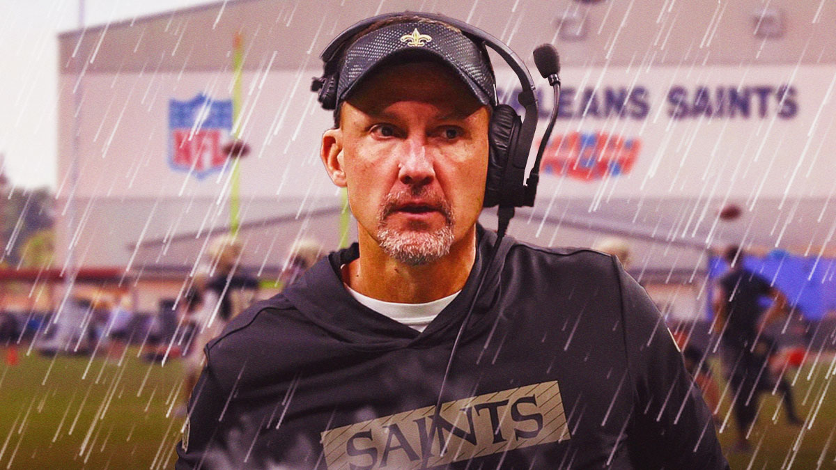 Head coach Dennis Allen at Saints facility with rainy background.