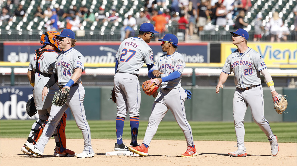New York Mets players celebrates after defeating the Chicago White Sox in a baseball game at Guaranteed Rate Field.