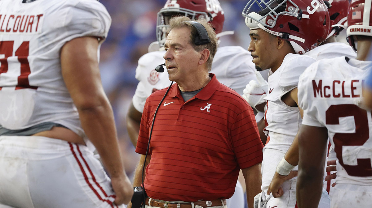 Sep 18, 2021; Gainesville, Florida, USA; Alabama Crimson Tide head coach Nick Saban talks with quarterback Bryce Young (9) and teammates against the Florida Gators during the second half at Ben Hill Griffin Stadium. Mandatory Credit: Kim Klement-Imagn Images