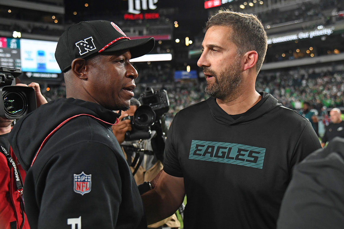 Atlanta Falcons head coach Raheem Morris and Philadelphia Eagles head coach Nick Sirianni meet on the field after game at Lincoln Financial Field.