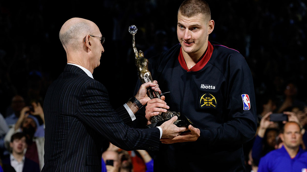NBA commissioner Adam Silver presents Denver Nuggets center Nikola Jokic (15) the KIA NBA MVP trophy before game five against the Minnesota Timberwolves in the second round for the 2024 NBA playoffs at Ball Arena.
