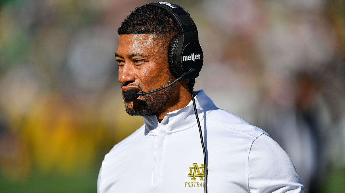 Notre Dame Fighting Irish head coach Marcus Freeman walks to the sideline in the second quarter against the Northern Illinois Huskies at Notre Dame Stadium.