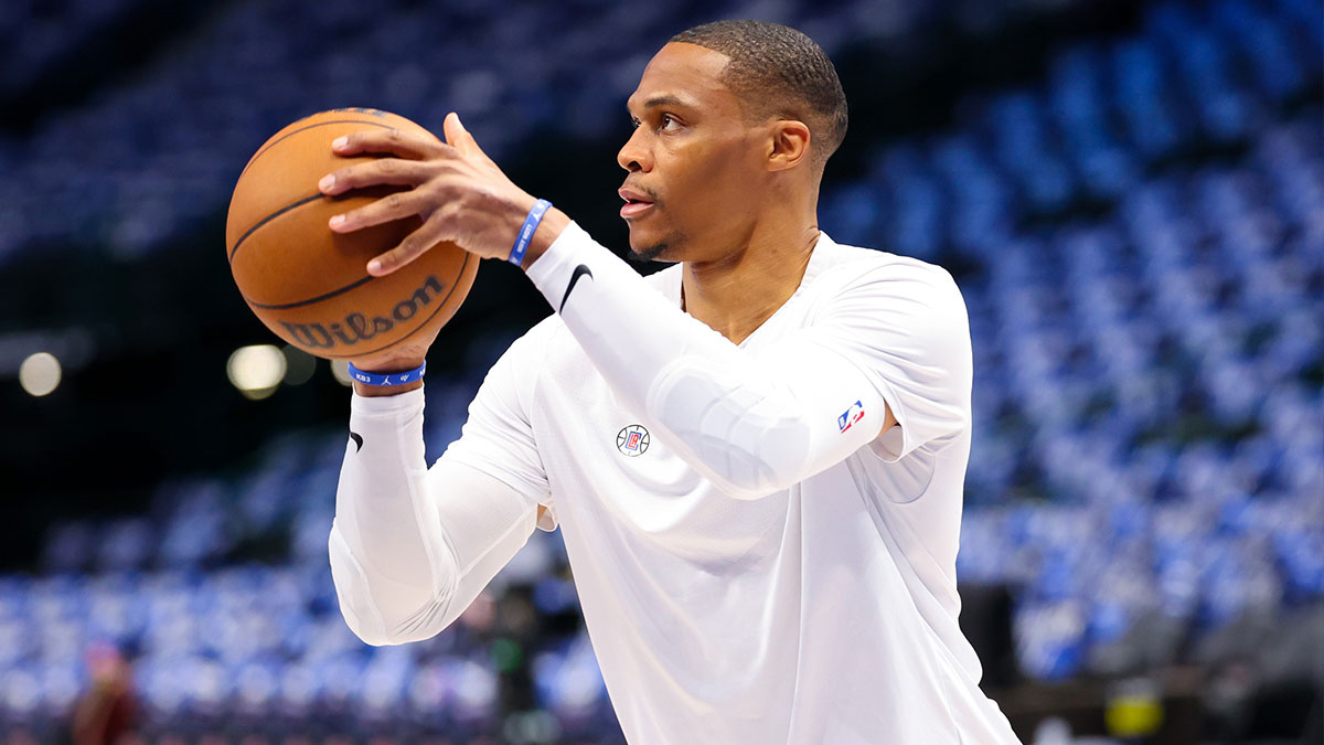 Russell Westbrook (0) warms up before the game against the Dallas Mavericks during game four of the first round for the 2024 NBA playoffs at American Airlines Center