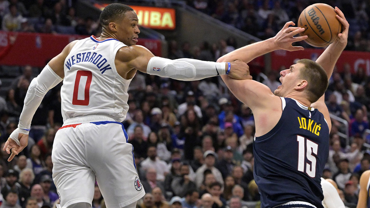 Nuggets center Nikola Jokic (15) is fouled by Los Angeles Clippers guard Russell Westbrook (0) in the second half at Crypto.com Arena