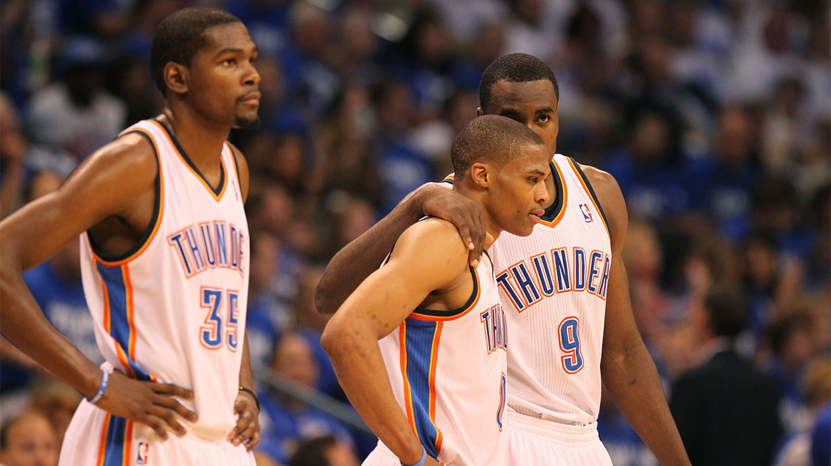 Oklahoma City Thunder forward Serge Ibaka (9) talks with guard Russell Westbrook (0) and with forward Kevin Durant (35) against the San Antonio Spurs during the first half in game four of the Western Conference finals of the 2012 NBA playoffs at Chesapeake Energy Arena. 