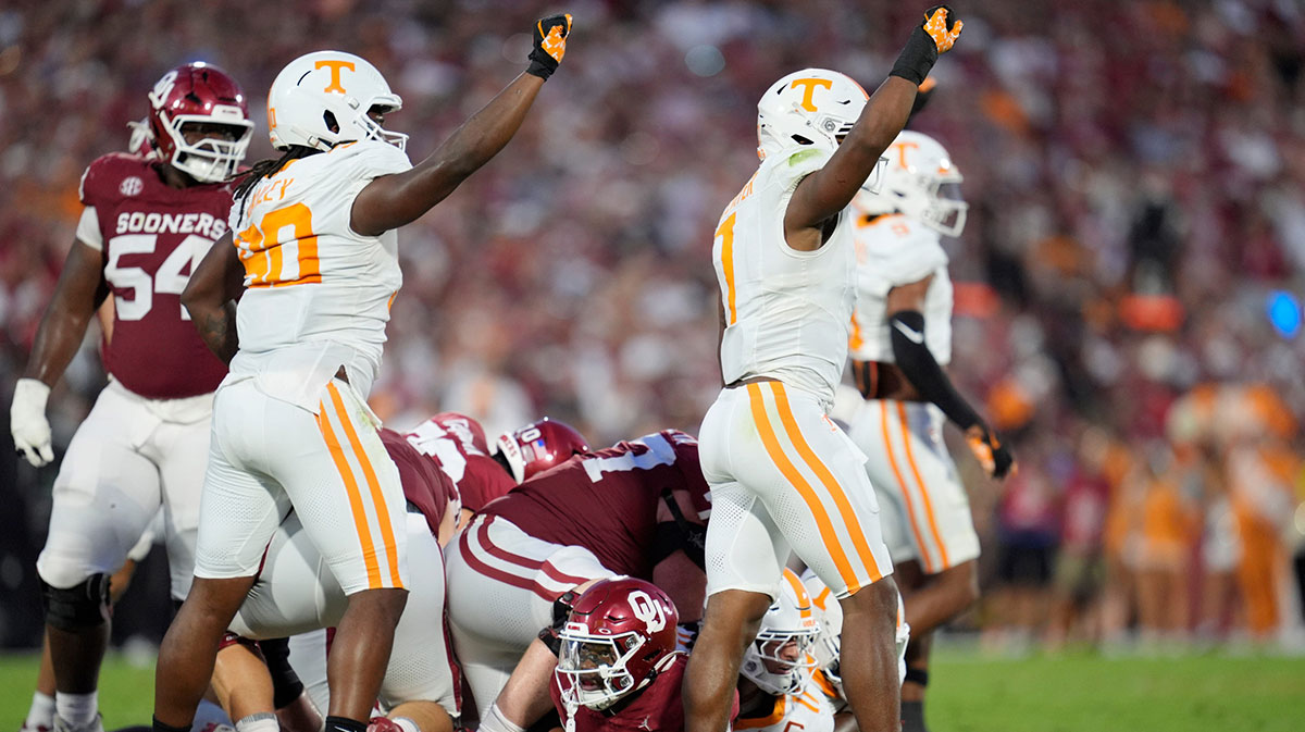 Oklahoma Sooners running back Jovantae Barnes (2) looks up as Tennessee Volunteers defensive lineman Dominic Bailey (90) and linebacker Arion Carter (7) celebrate after a defensive stop during a college football game between the University of Oklahoma Sooners (OU) and the Tennessee Volunteers at Gaylord Family - Oklahoma Memorial Stadium in Norman, Okla., Saturday, Sept. 21, 2024.