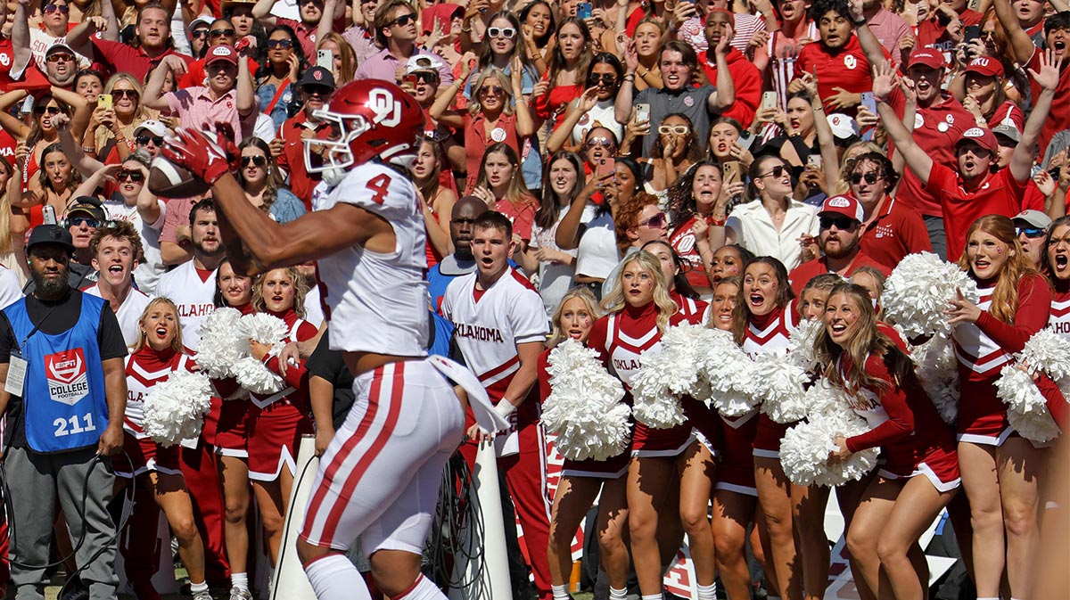 Oklahoma fans watch as Oklahoma Sooners wide receiver Nic Anderson (4) catches a touchdown pass in the final seconds of the Red River Rivalry college football game between the University of Oklahoma Sooners (OU) and the University of Texas (UT) Longhorns at the Cotton Bowl in Dallas, Saturday, Oct. 7, 2023. Oklahoma won 34-30.