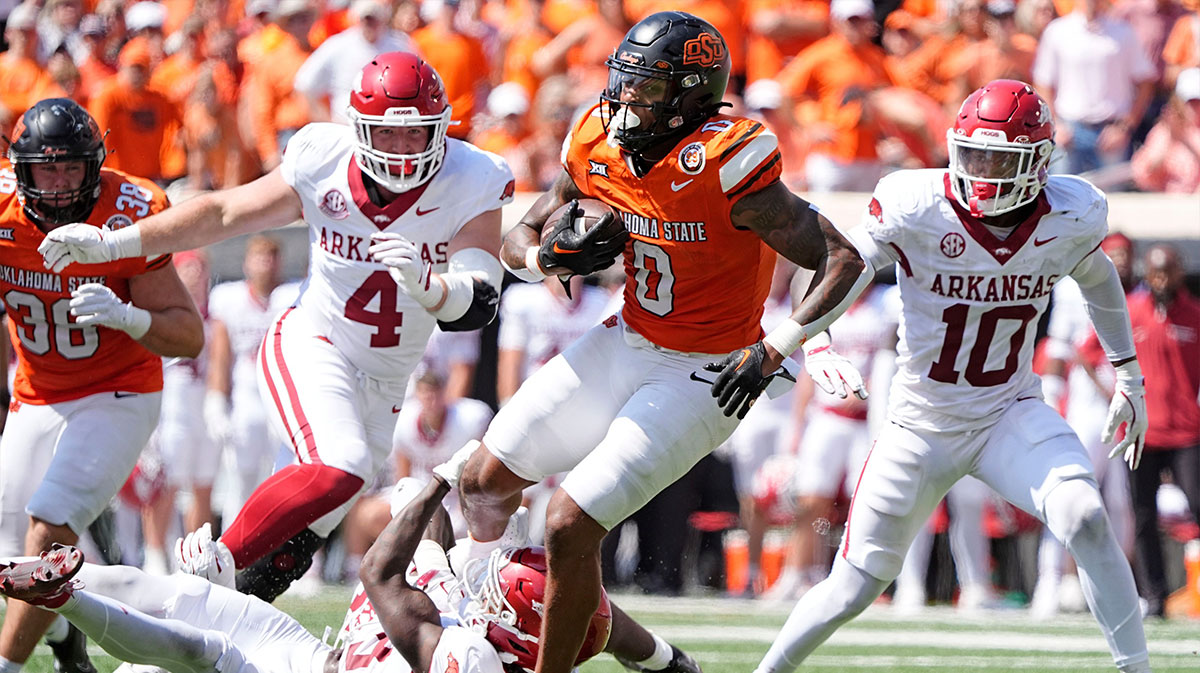 Oklahoma State's Ollie Gordon II (0) rushes in the second half of the college football game between the Oklahoma State Cowboys and the Arkansas Razorbacks at Boone Pickens Stadium