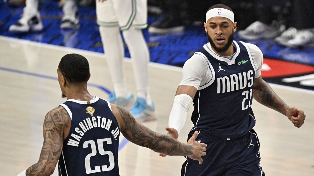 Dallas Mavericks center Daniel Gafford (21) celebrates with forward PJ Washington (25) after action during the first quarter of Game 3 of the 2024 NBA Finals against the Boston Celtics at the American Airlines Center.