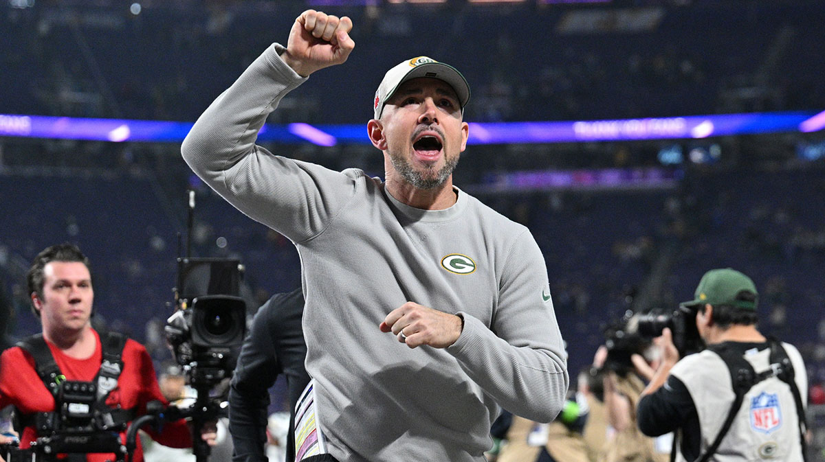 Green Bay Packers head coach Matt LaFleur runs off the field after the game against the Minnesota Vikings at U.S. Bank Stadium.