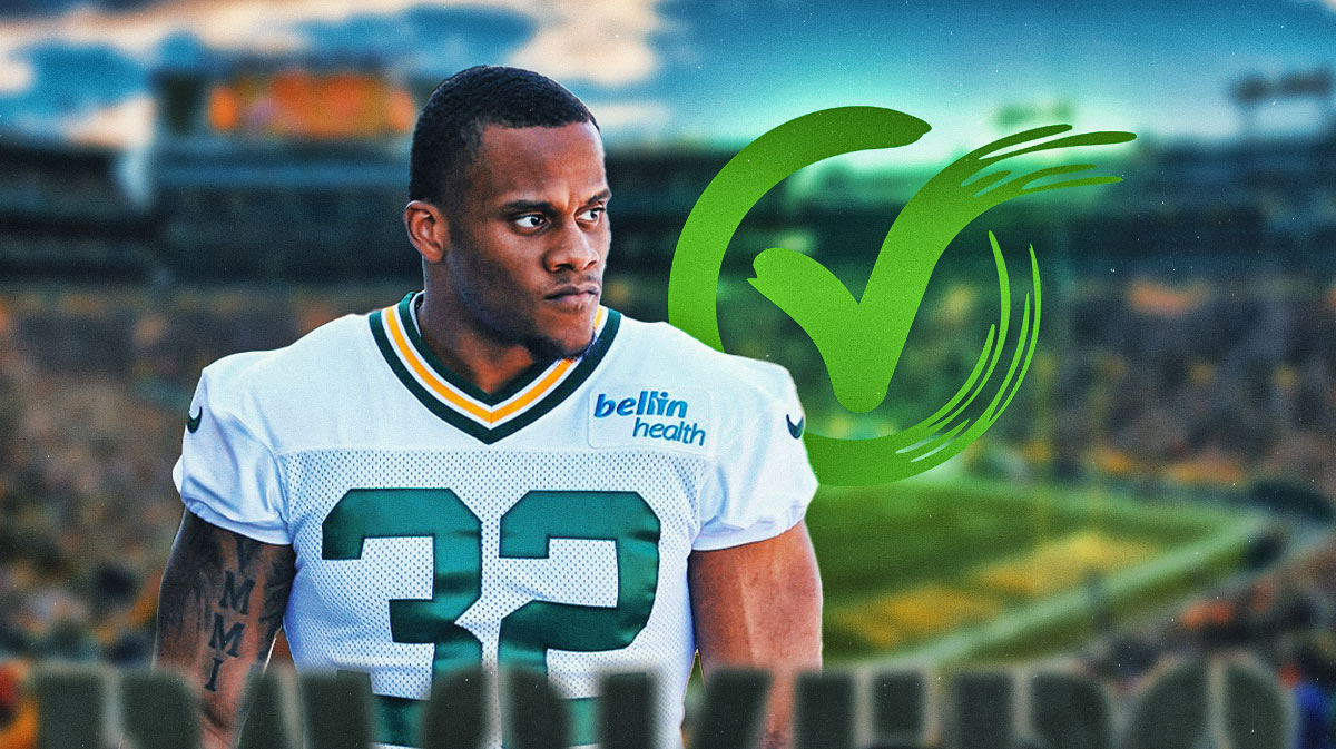 MarShawn Lloyd in a Packers jersey with a green check mark next to him.