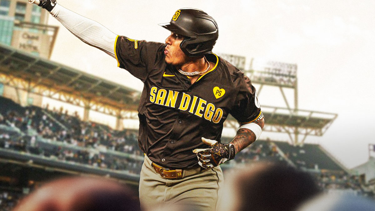 Manny Machado in Padres uniform with arms raised in celebration