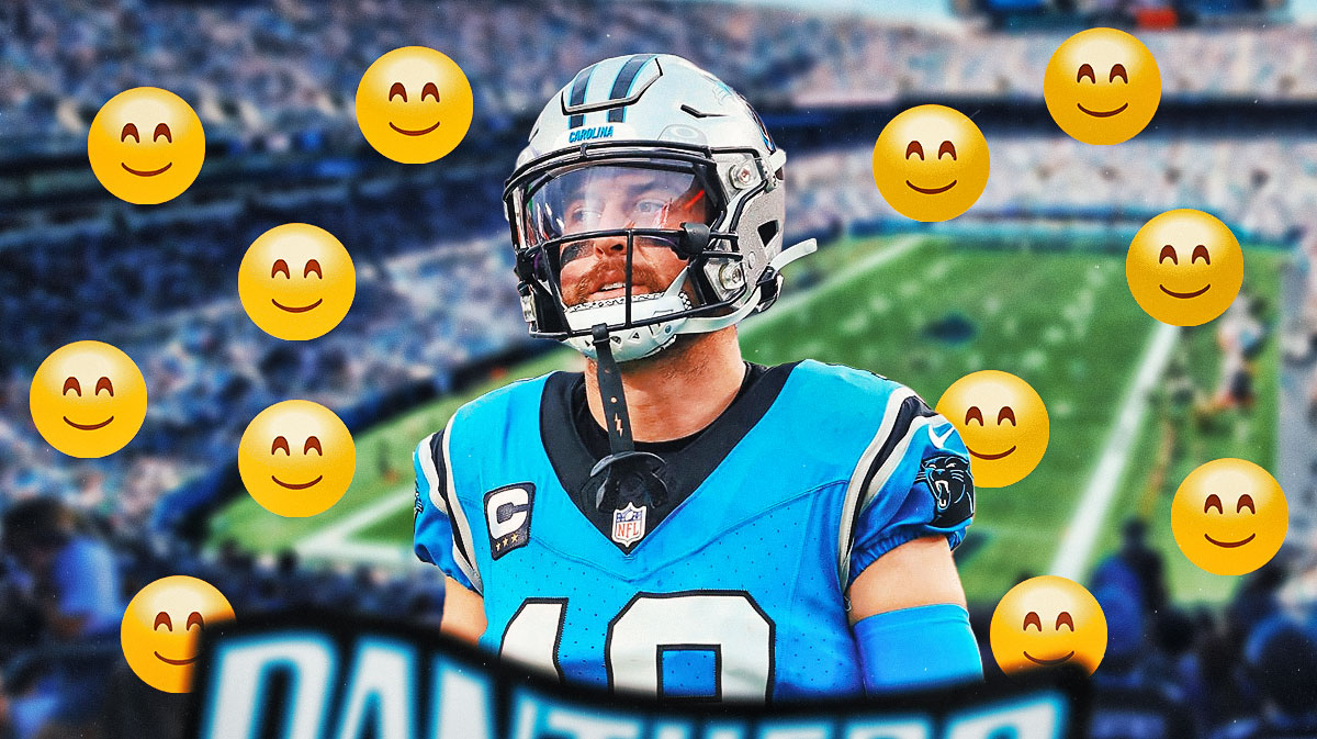 Adam Thielen in a Panthers jersey with smile face emojis in the picture.