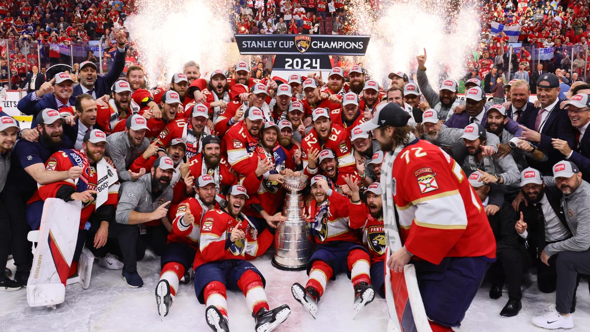 Florida Panthers players react as goaltender Sergei Bobrovsky (72) arrives for a team photo with the cup after game seven of the 2024 Stanley Cup Final against the Edmonton Oilers at Amerant Bank Arena.
