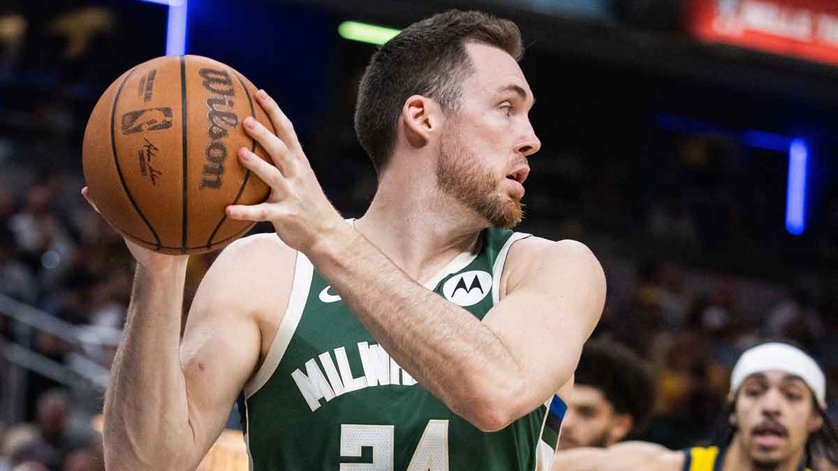 Milwaukee Bucks guard Pat Connaughton (24) holds the ball while Indiana Pacers guard Andrew Nembhard (2) defends during game four of the first round for the 2024 NBA playoffs at Gainbridge Fieldhouse