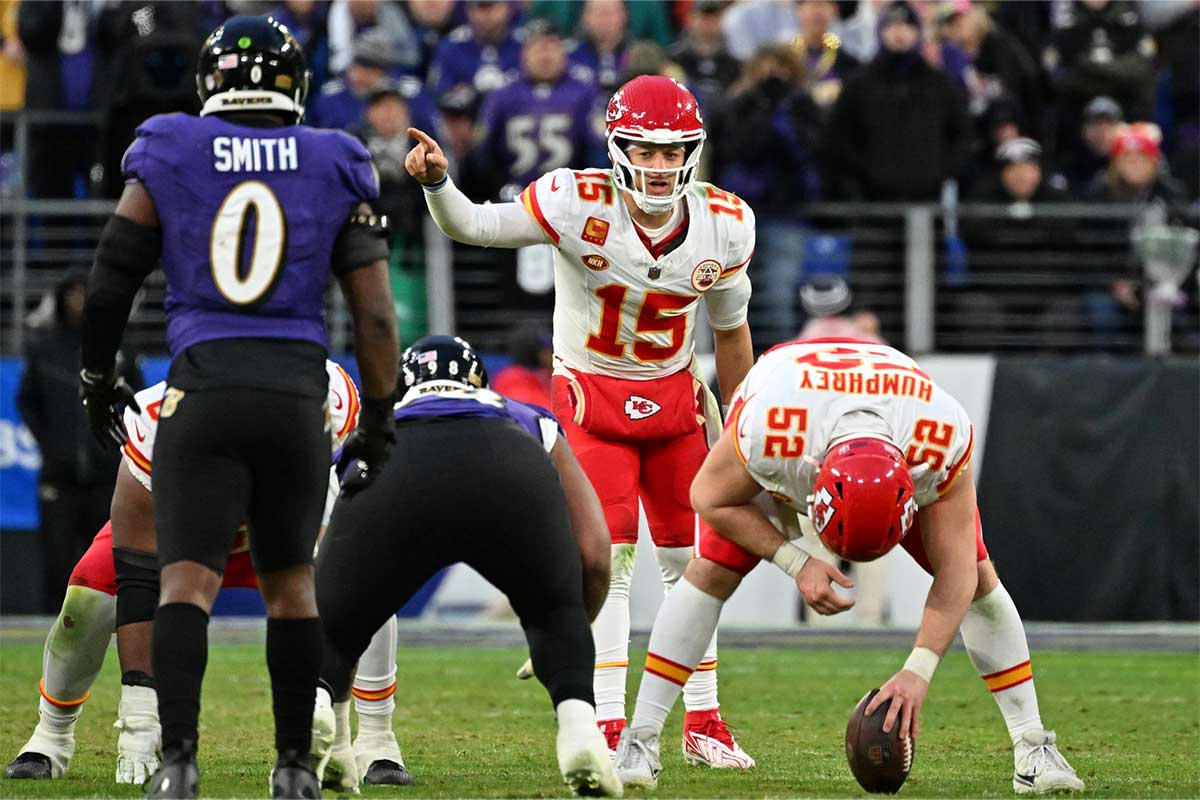 Kansas City Chiefs quarterback Patrick Mahomes (15) signals before a snap against the Baltimore Ravens during the second half in the AFC Championship football game at M&T Bank Stadium.