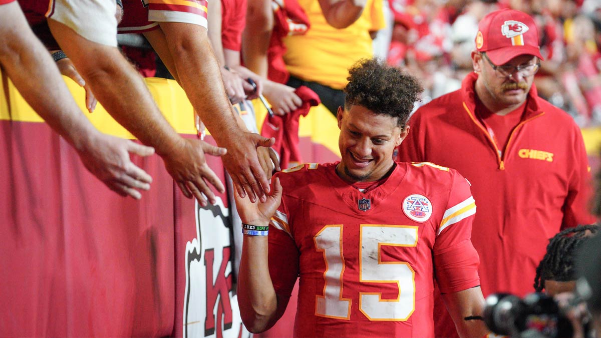 Kansas City Chiefs quarterback Patrick Mahomes (15) greets fans as he leaves the field after the win over the Baltimore Ravens at GEHA Field at Arrowhead Stadium.