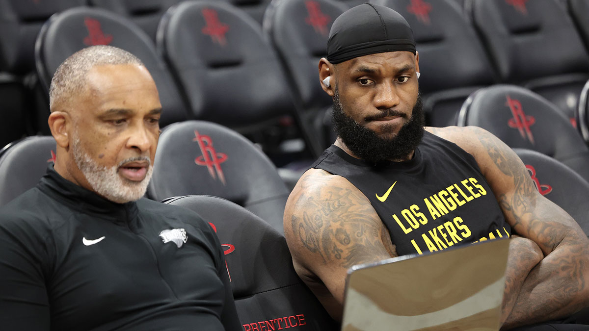 Nov 8, 2023; Houston, Texas, USA; Los Angeles Lakers forward LeBron James (23) looks over video with assistant coach Phil Handy before playing against the Houston Rockets at Toyota Center. Mandatory Credit: Thomas Shea-Imagn Images