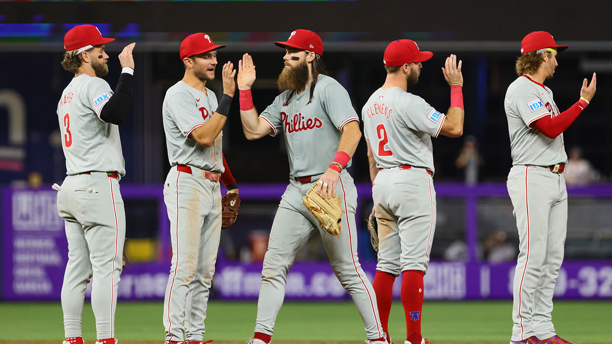 Philadelphia Phillies first baseman Bryce Harper (3), shortstop Trea Turner (7), left fielder Brandon Marsh (16), third baseman Kody Clemens (2), and second baseman Bryson Stott (5) celebrate after the game against the Miami Marlins at loanDepot Park.