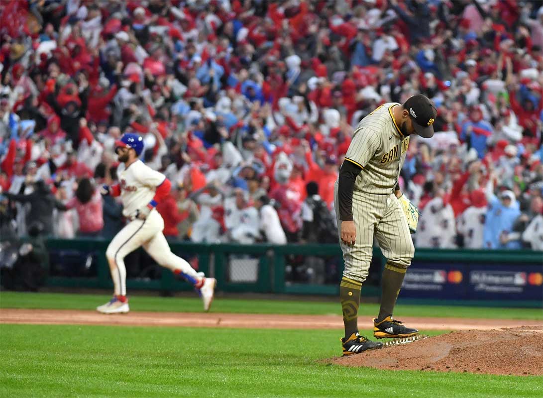 San Diego Padres relief pitcher Robert Suarez (75) reacts after Philadelphia Phillies designated hitter Bryce Harper (3) hits a two-run home run in the eighth inning during game five of the NLCS for the 2022 MLB Playoffs at Citizens Bank Park