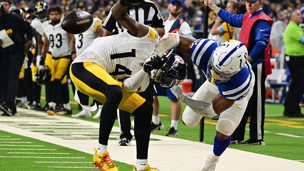 Indianapolis Colts safety Nick Cross (20) knocks the ball out of hands of Pittsburgh Steelers wide receiver George Pickens (14) for a fumble during the second quarter at Lucas Oil Stadium.