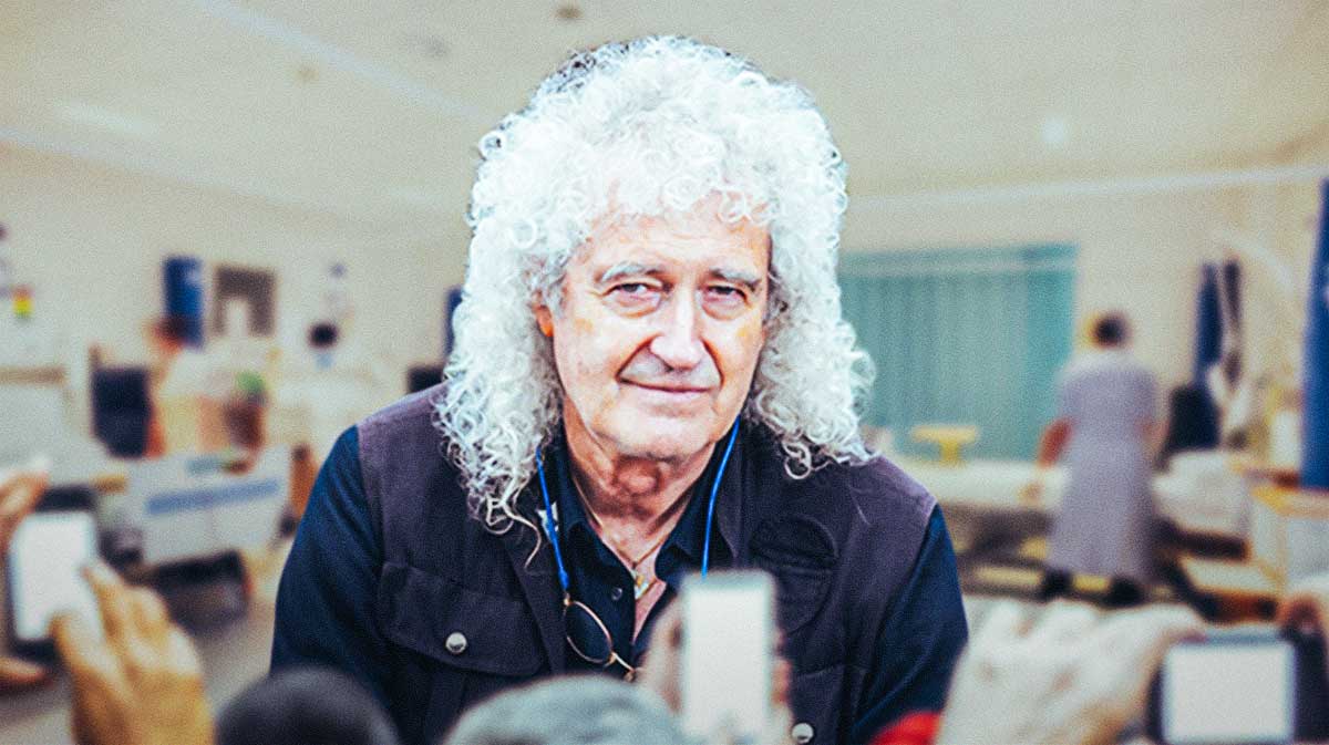 Queen guitarist Brian May with hospital background after suffering a 'minor' stroke.