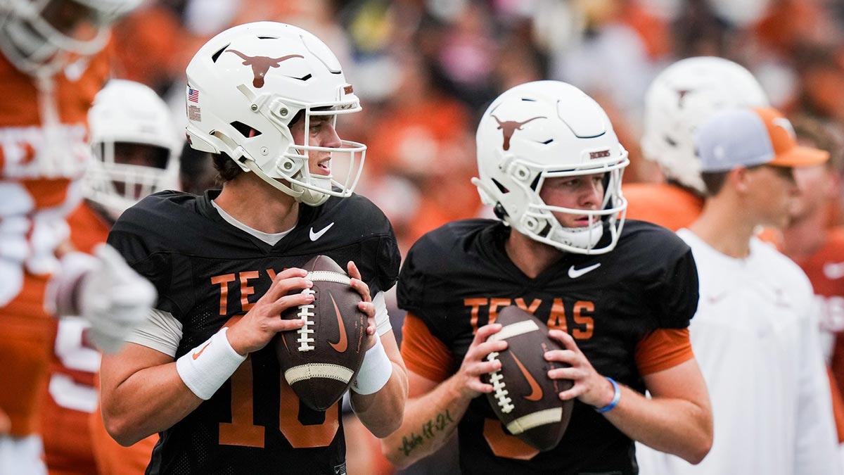 Texas Longhorns quarterbacks Arch Manning (16), left, and Quinn Ewers (3) throw passes while warming up ahead of the Longhorns' spring Orange and White game at Darrell K Royal Texas Memorial Stadium in Austin, Texas, April 20, 2024.
