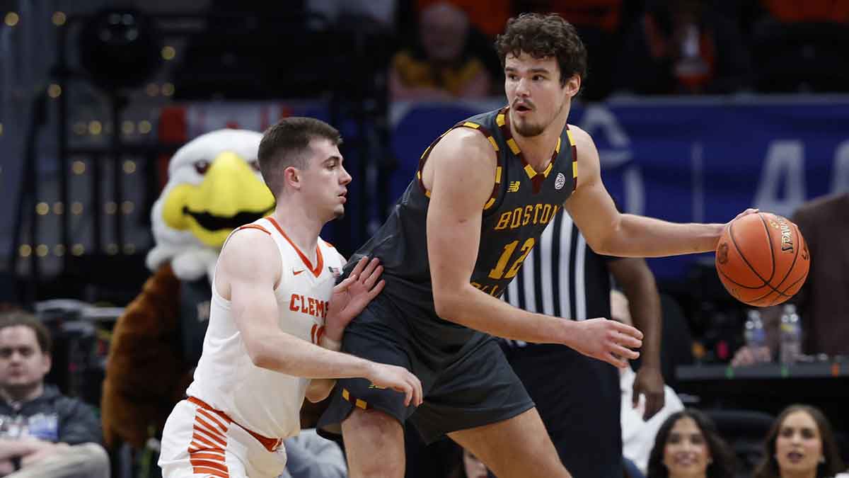 Boston College Eagles forward and Golden State Warriors draft pick Quinten Post (12) dribbles the ball as Clemson Tigers guard Joseph Girard III (11) defends in the second half at Capital One Arena.