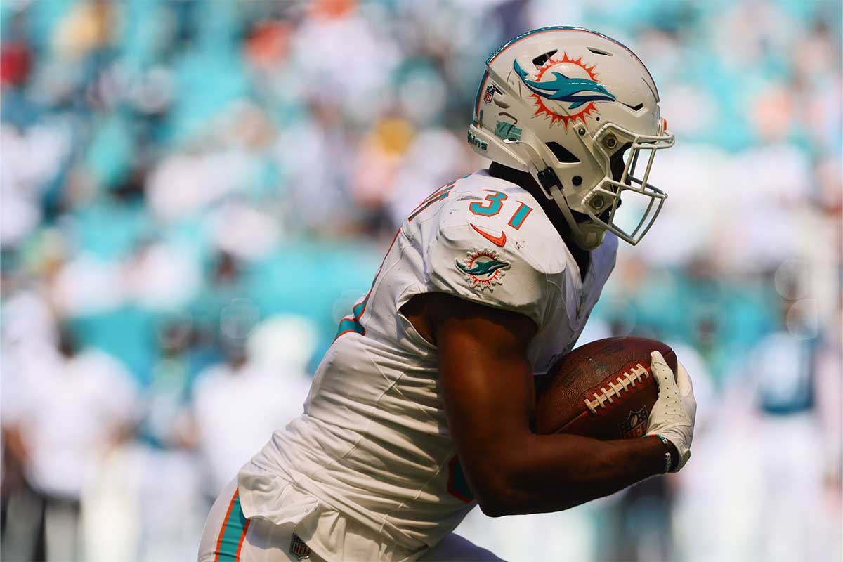 Miami Dolphins running back Raheem Mostert (31) runs with the football against the Jacksonville Jaguars during the third quarter at Hard Rock Stadium.