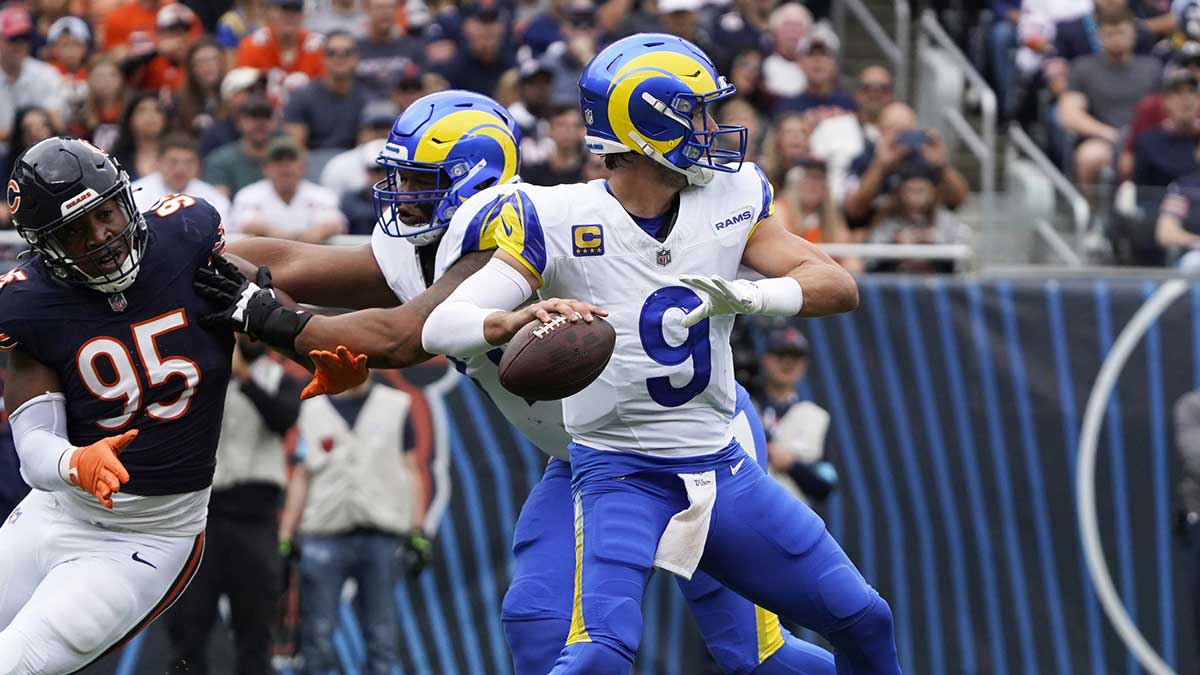 Los Angeles Rams quarterback Matthew Stafford (9) passes the ball against the Chicago Bears during the first half at Soldier Field.