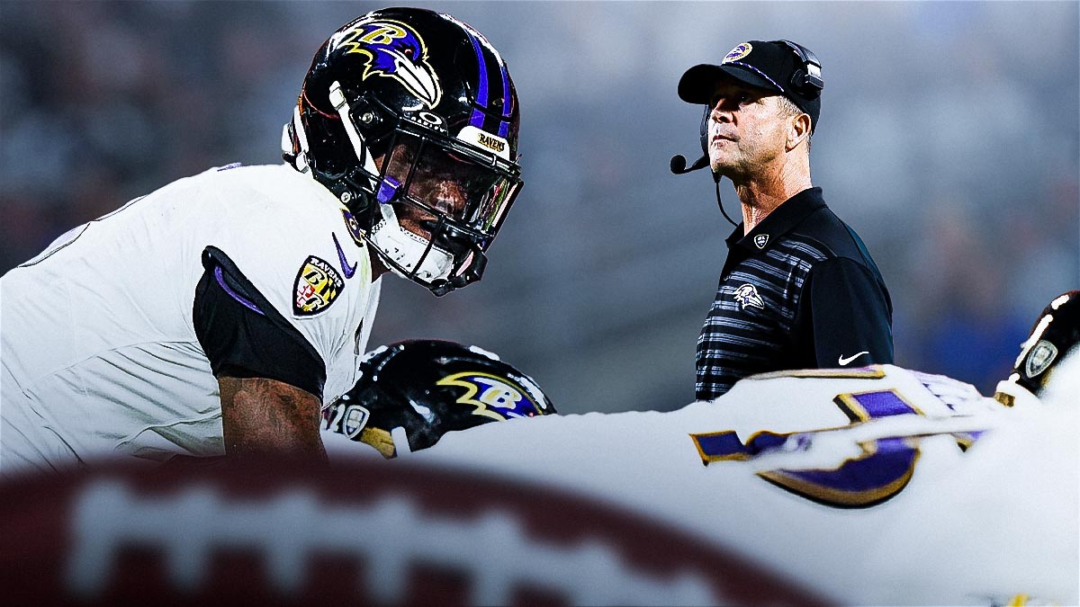 Lamar Jackson and his defense players next to head coach John Harbaugh