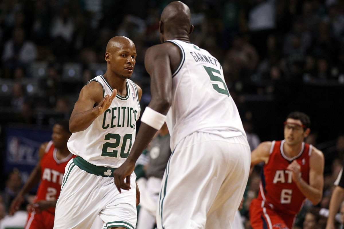 Boston Celtics shooting guard Ray Allen (20) reacts to his three point basket with teammate Boston Celtics power forward Kevin Garnett (5) as they take on the Atlanta Hawks in the second quarter of game four in the Eastern Conference quarterfinals of the 2012 NBA Playoffs at the TD Garden.