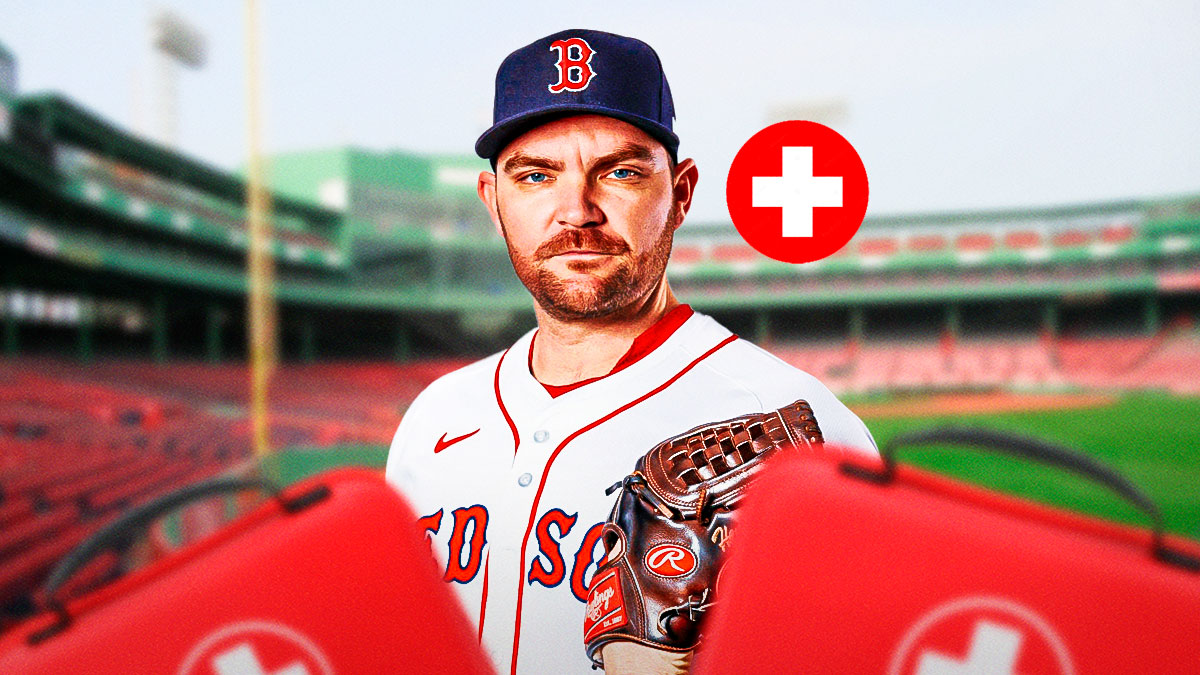 Red Sox's Liam Hendriks with a red cross sign next to him and holding a first aid kid