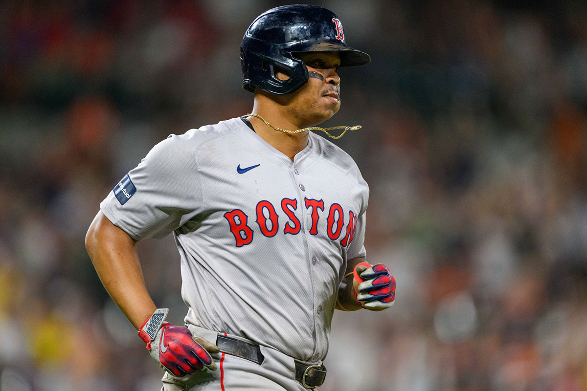 Boston Red Sox third baseman Rafael Devers (11) runs to first base after hitting a home run during the eighth inning against the Baltimore Orioles at Oriole Park at Camden Yards