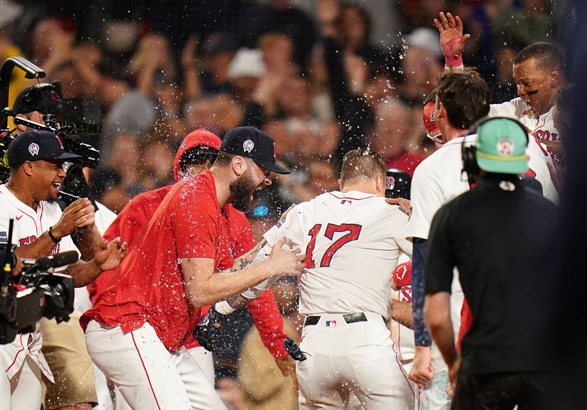 Boston Red Sox left fielder Tyler O'Neill (17) his a three run home run to win the game against the Baltimore Orioles in ten innings at Fenway Park