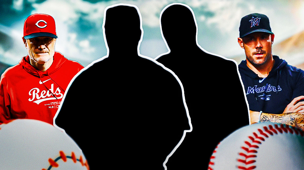 Cincinnati Reds manager David Bell on the left (no smile) - Miami Marlins manager Skip Schumaker on the right - silhouettes of Barry Larkin and Eduardo Perez