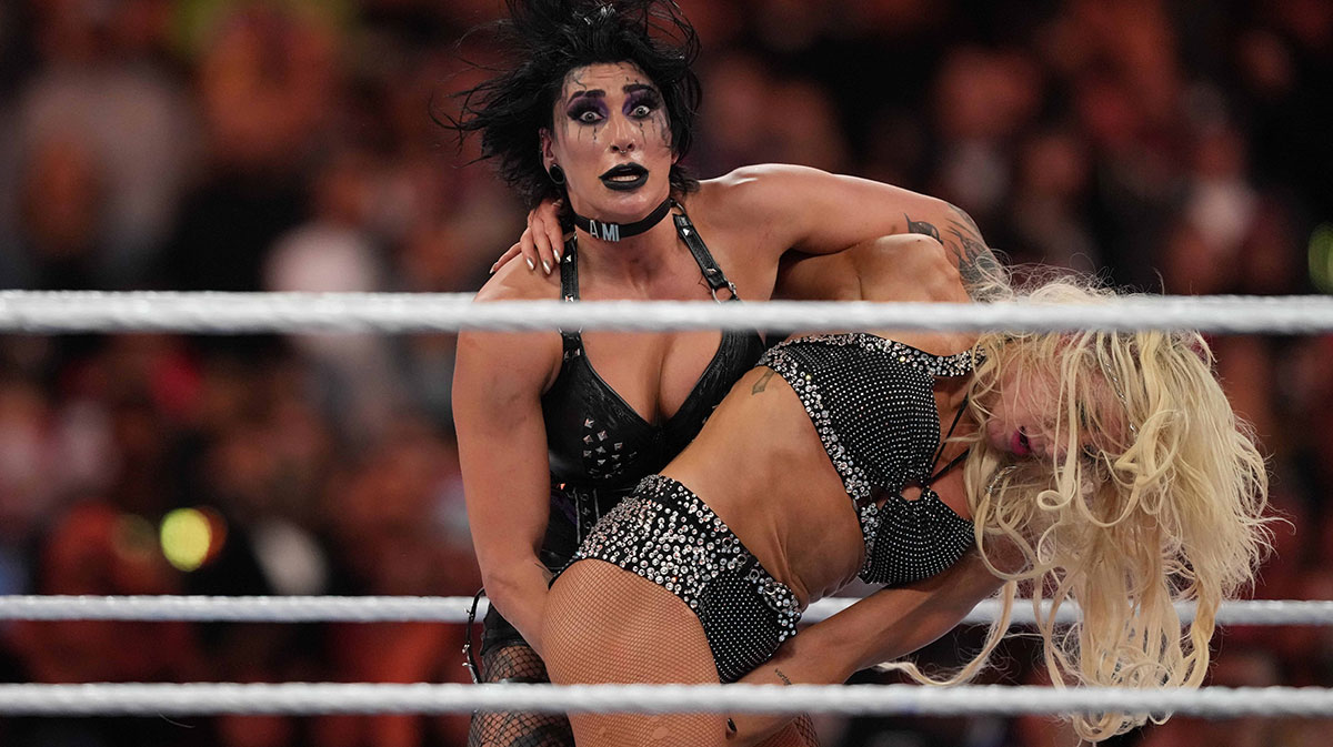 Rhea Ripley attempting to hit Riptide on Charlotte Flair at WrestleMania 39.