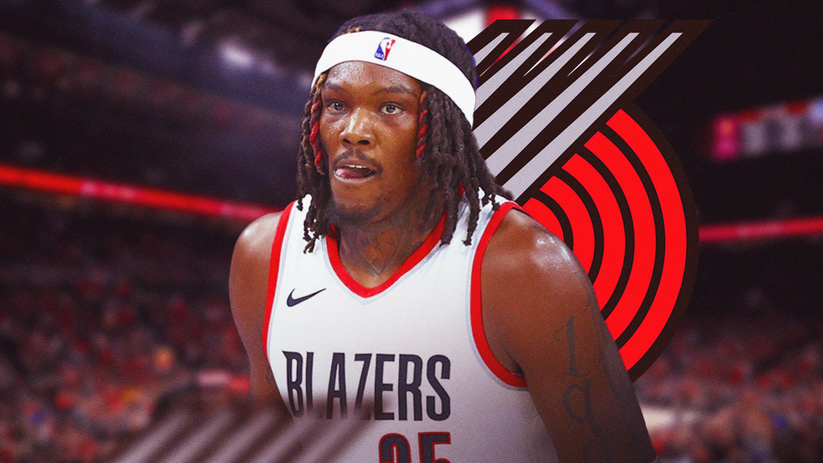 Robert Williams III with Portland Trail Blazers logo behind him