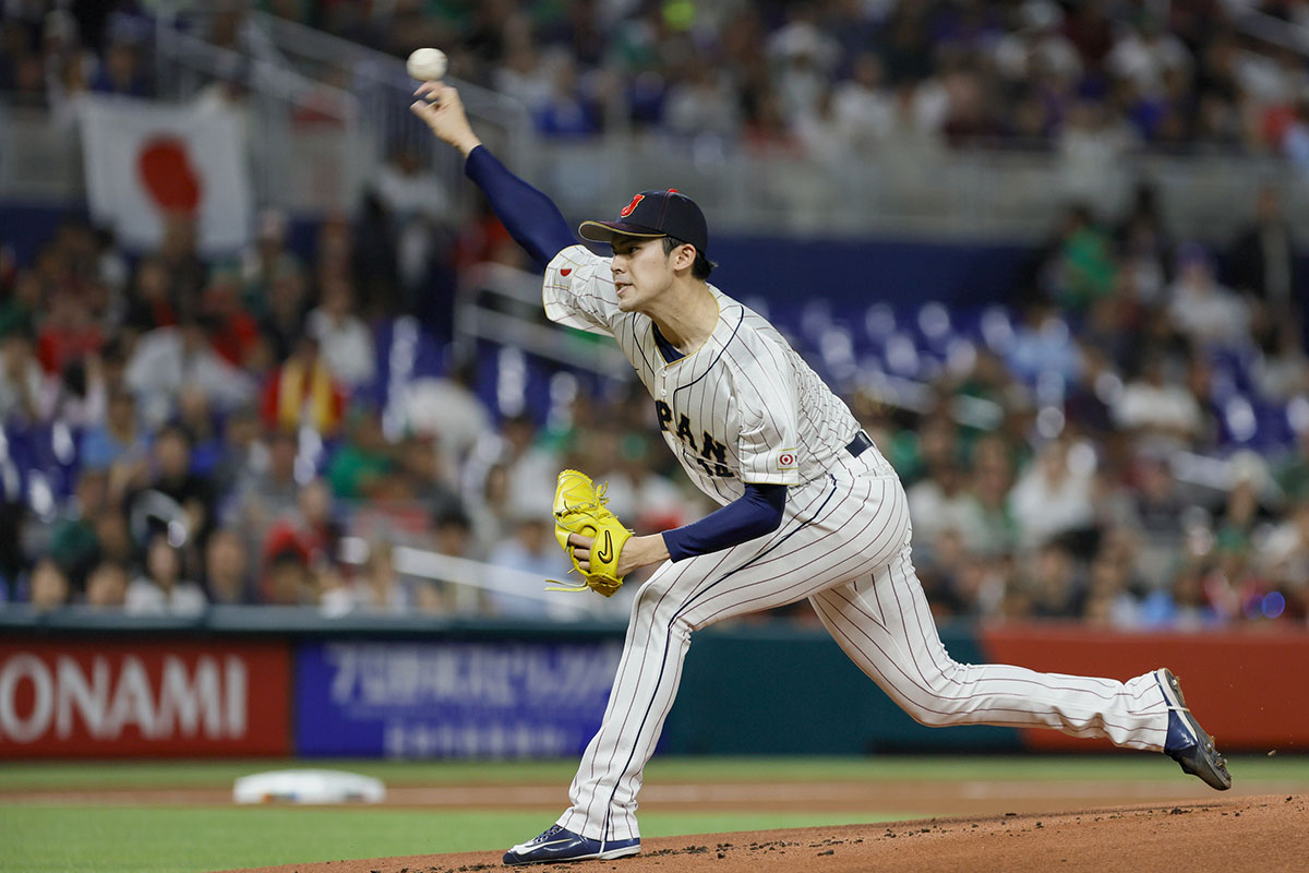 Japan starting pitcher Roki Sasaki (14) delivers a pitch during the first inning against Mexico at LoanDepot Park.