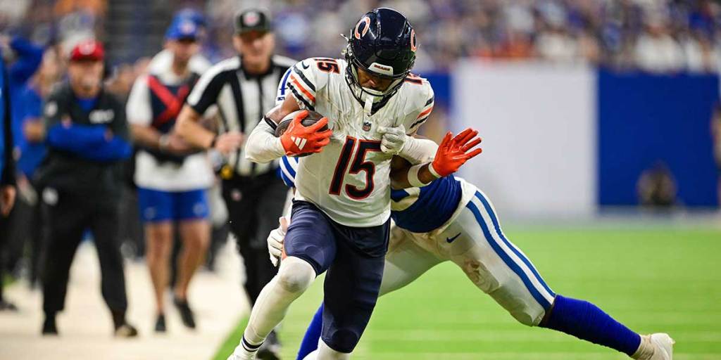 Chicago Bears wide receiver Rome Odunze (15) is tackled by Indianapolis Colts safety Nick Cross (20) during the second half at Lucas Oil Stadium.
