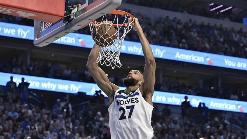 Minnesota Timberwolves center Rudy Gobert (27) shoots against the Dallas Mavericks in the second quarter during Game 3 of the Western Conference Finals of the 2024 NBA Playoffs at American Airlines Center.