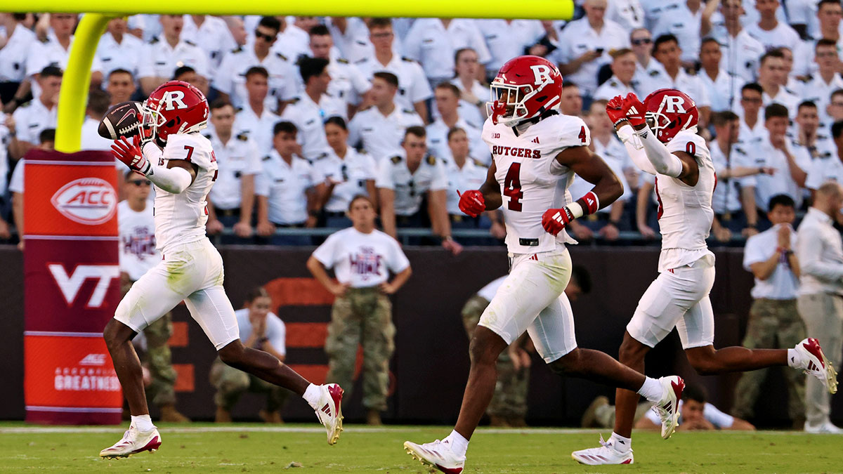 Rutgers Scarlet Knights defensive back Robert Longerbeam (7) celebrates after making an interception during the fourth quarter against the Virginia Tech Hokies at Lane Stadium.