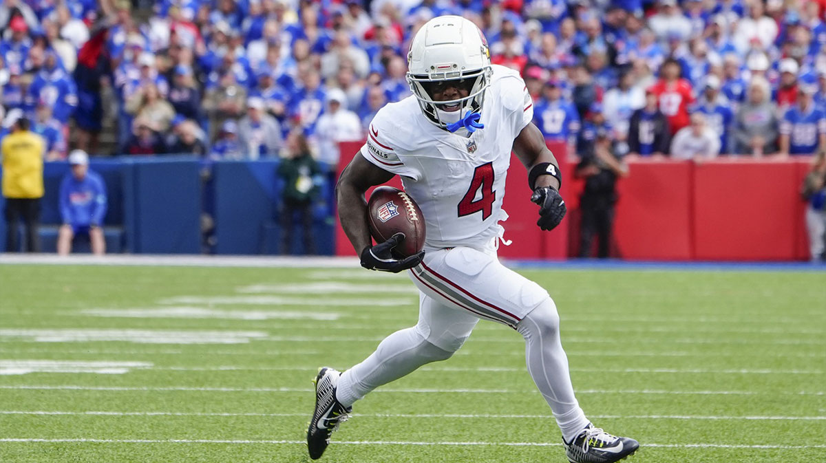 Arizona Cardinals wide receiver Greg Dortch (4) runs with the ball against the Buffalo Bills during the second half at Highmark Stadium.