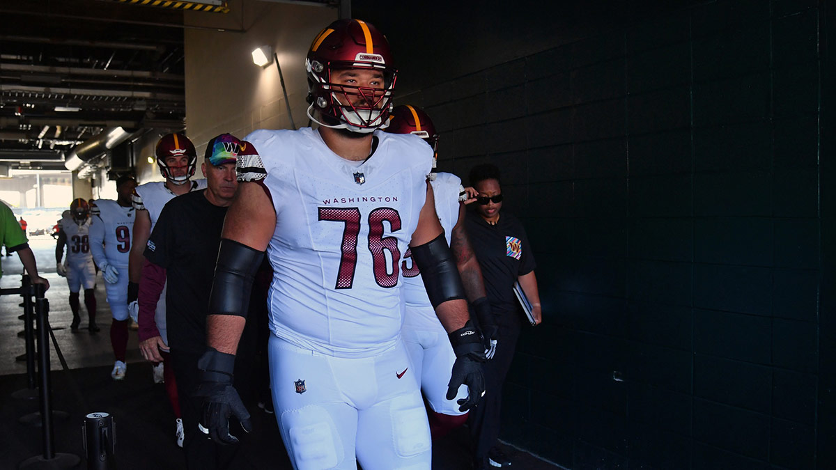 Washington Commanders offensive tackle Sam Cosmi (76) leads his team in the tunnel against the Philadelphia Eagles at Lincoln Financial Field.