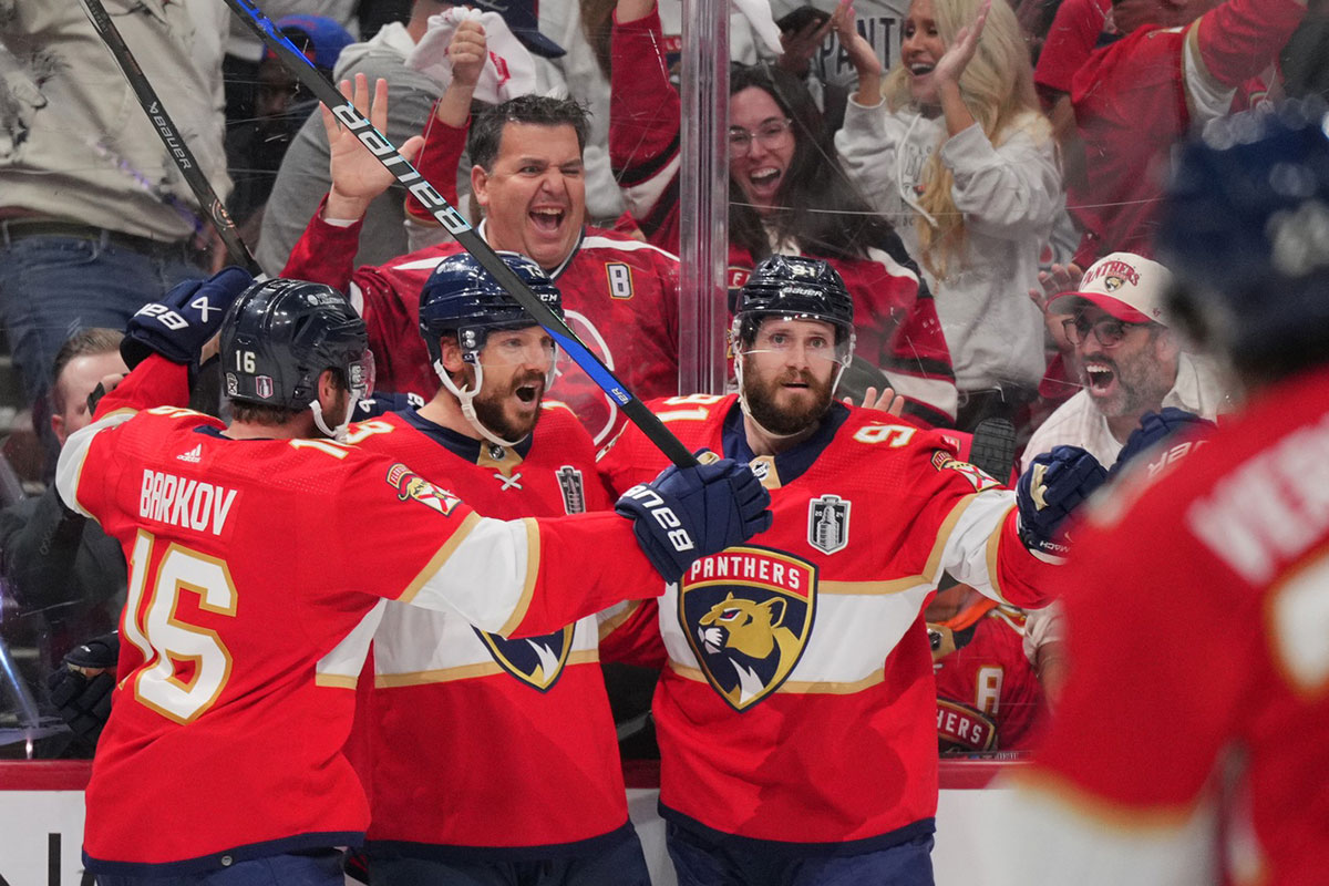 Florida Panthers forward Sam Reinhart (13) celebrates scoring during the second period against the Edmonton Oilers with forward Aleksander Barkov (16) and defenseman Oliver Ekman-Larsson (91) in game seven of the 2024 Stanley Cup Final at Amerant Bank Arena.